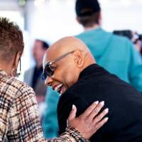 Two event guests in conversation and laughing